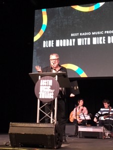 Mike Buck accepts the award for Best Radio Music Program.